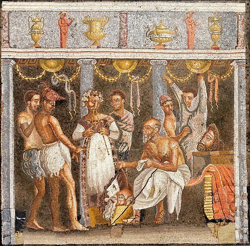 A group of actors and musicians in a mosaic.